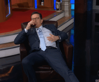 Man in Suit and Tie Sitting Cross-Legged