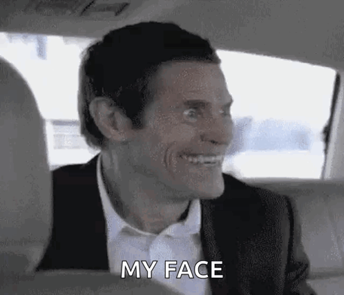 Man In Suit And Tie Sitting In Back Seat Of Car GIF