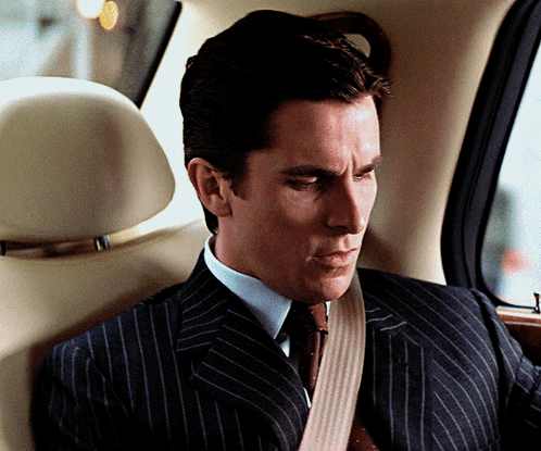 Man in Suit and Tie Sitting in Car