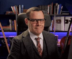 Man in Suit and Tie Sitting