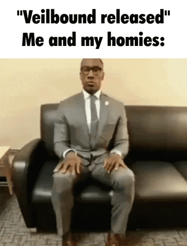 Man In Suit And Tie Sitting On Couch Saying Veilbound Released Me And My Homies GIF