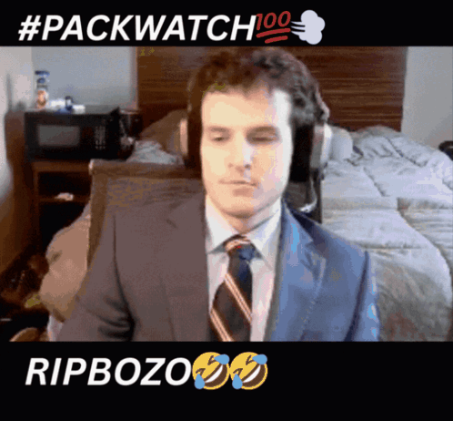Man In Suit And Tie Sitting #Packwatch 100 GIF