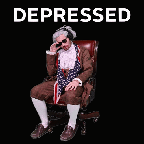 Man in Suit and Tie Sitting With Depressed
