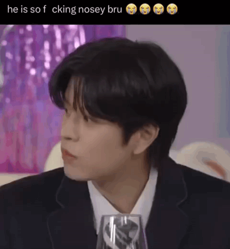 Man in Suit and Tie Sitting With Wine Glass