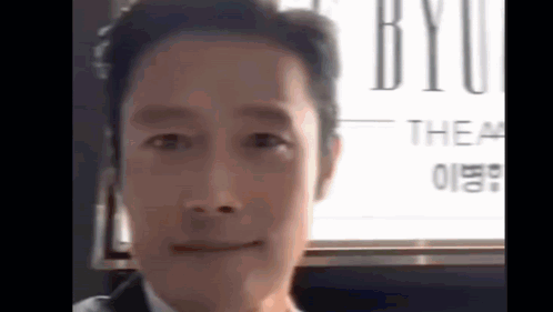 Man in Suit and Tie Smiling at Camera