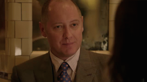 Man In Suit And Tie Smiling At Woman GIF