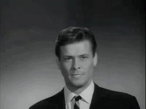 Man in Suit and Tie Smiling Black and White