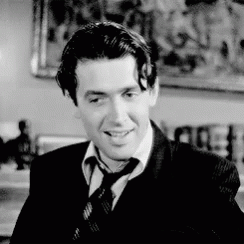 Man in Suit and Tie Smiling in Black and White