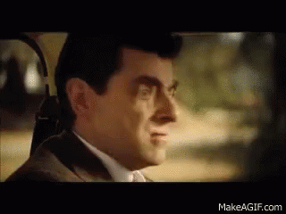 Man In Suit And Tie Smiling In Car GIF