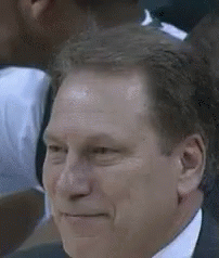 Man In Suit And Tie Smiling In Crowd GIF