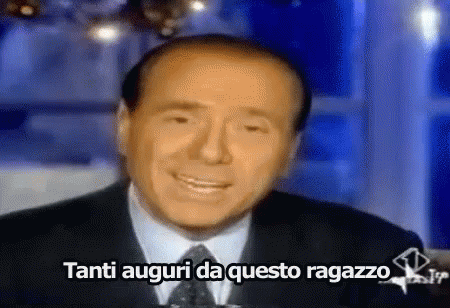 Man In Suit And Tie Smiling Tanti Auguri Da Questo Ragazzo GIF