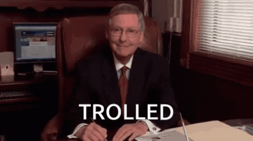 Man in Suit and Tie Smiling Trolled