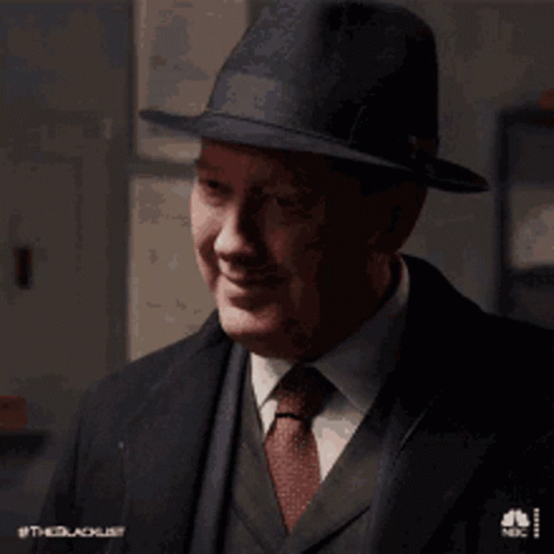 Man In Suit And Tie Smiling With Hat GIF