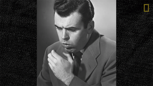 Man in Suit and Tie Smoking Cigarette Black and White