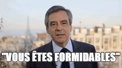 Man In Suit And Tie Speaking Before City GIF