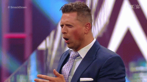 Man in Suit and Tie Speaking
