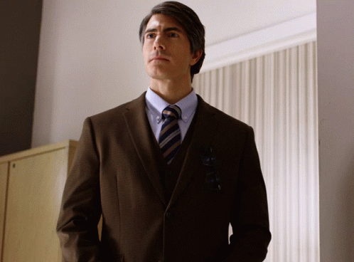 Man in Suit and Tie Standing