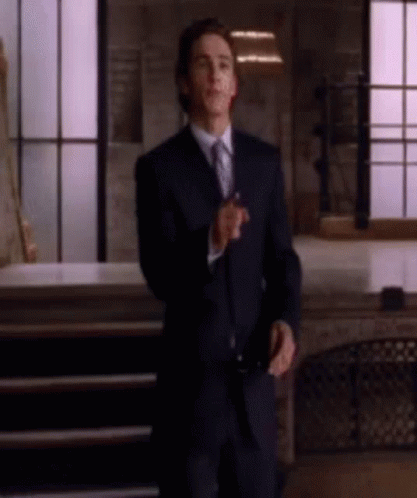 Man In Suit And Tie Standing GIF