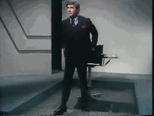 Man in Suit and Tie Standing