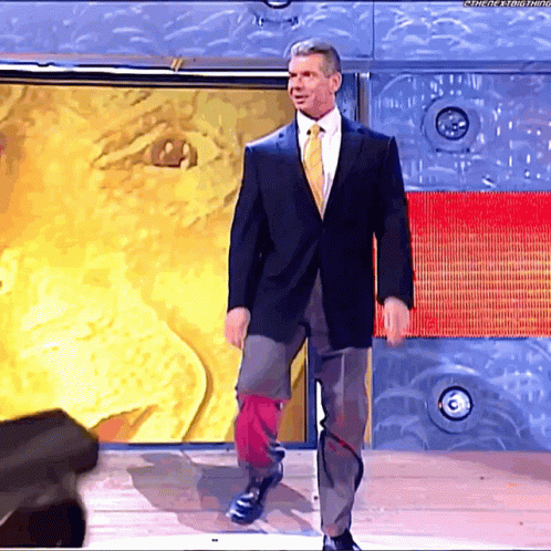 Man in Suit and Tie Standing in Front of Wall Saying The Next Thing