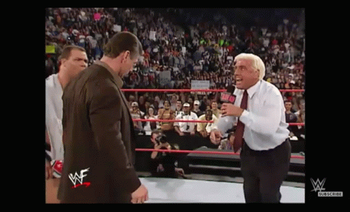 Man in Suit and Tie Standing in Wrestling Ring