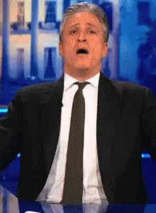 Man In Suit And Tie Surprised Face GIF