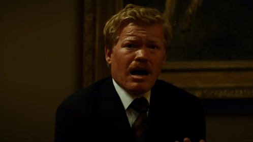 Man in Suit and Tie Talking