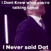 Man in Suit and Tie Talking Purple Background