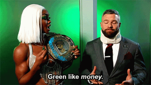 Man In Suit And Tie Talking To Woman In White Wig GIF