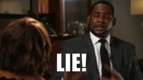Man In Suit And Tie Talking To Woman Lie GIF