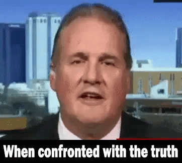 Man in Suit and Tie Talking When Confronted with the Truth