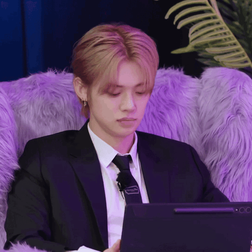 Man in Suit and Tie Using Laptop