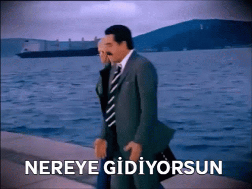Man in Suit and Tie Walking by Water Nereye Gidiyorsun