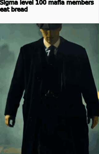 Man in Suit and Tie Walking in Dark