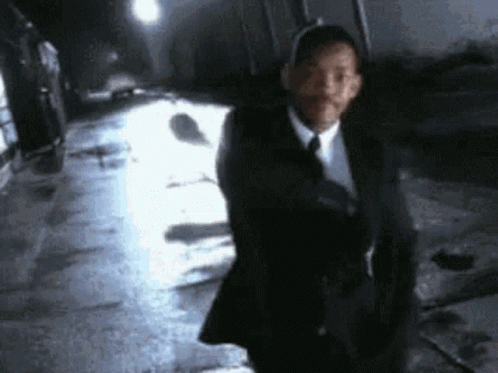 Man in Suit and Tie Walking
