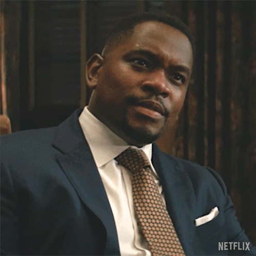 Man in Suit and Tie Waving Netflix