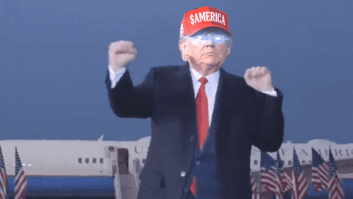 Man In Suit And Tie Wearing Red Hat Saying Samerica GIF