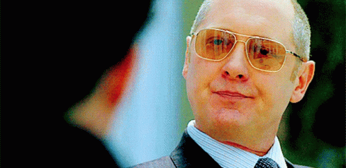 Man In Suit And Tie Wearing Sunglasses GIF