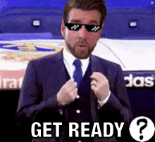 Man in Suit and Tie Wearing Sunglasses Says Get Ready