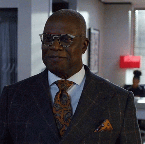 Man In Suit And Tie Wearing Sunglasses GIF