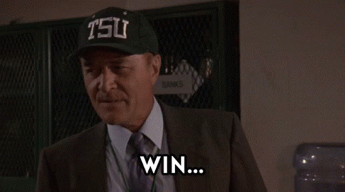 Man in Suit and Tie Wearing Tsu Hat
