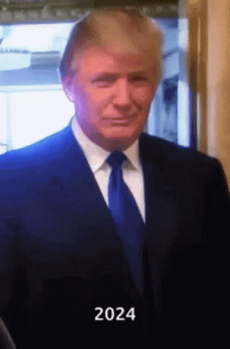 Man in Suit and Tie With 2024