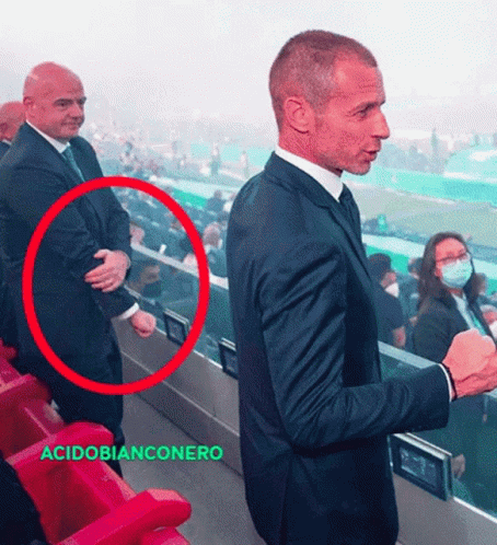 Man in Suit and Tie with Acidobianconero Red Circle