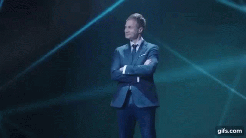 Man in Suit and Tie with Arms Crossed
