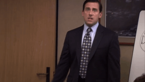 Man In Suit And Tie With Arms Outstretched GIF