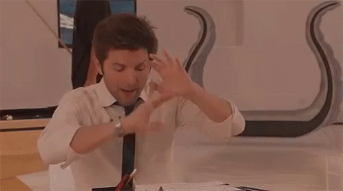 Man in Suit and Tie with Arms Outstretched