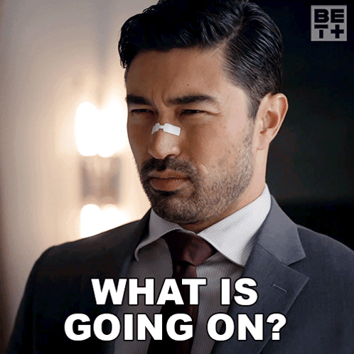 Man in Suit and Tie with Bandage on Nose