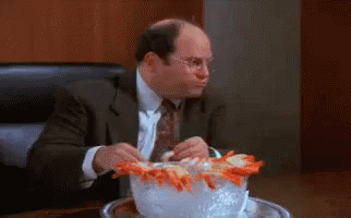 Man in Suit and Tie with Bowl of Shrimp