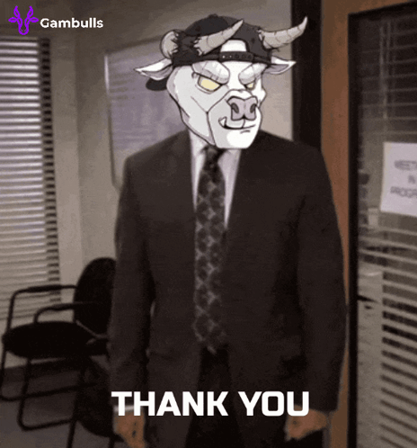 Man in Suit and Tie with Bull Mask Says Thank You