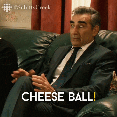 Man In Suit And Tie With Cheese Ball GIF